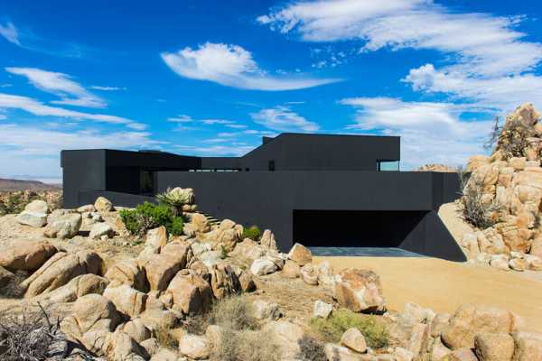 Black Desert House: Imposing Architecture and Dramatic Landscape