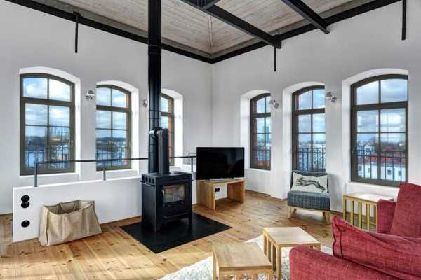 Water Tower Converted into a Unique Vacation Home with Beautiful Views Over the Rooftops of Berlin