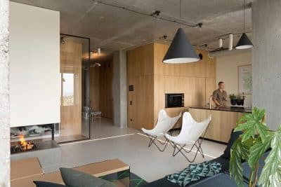 Penthouse with Concrete Ceiling and a Glass-Wall Windows