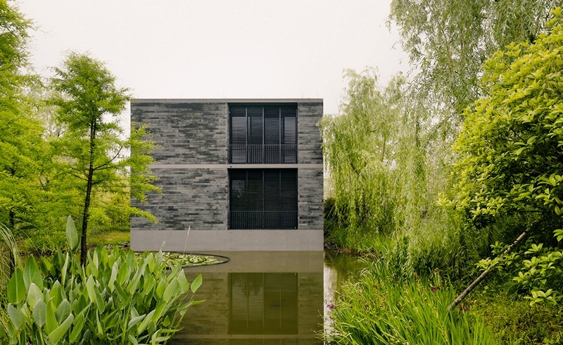 Apartment buildings surrounded by a water garden and wild landscape (1)