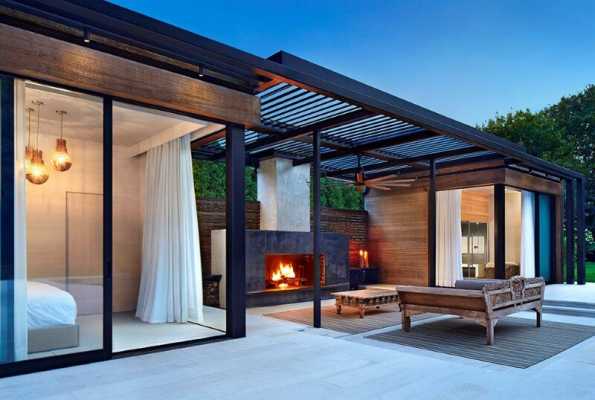 Lavish pool and spa retreat with a stunning wood and steel structure 9