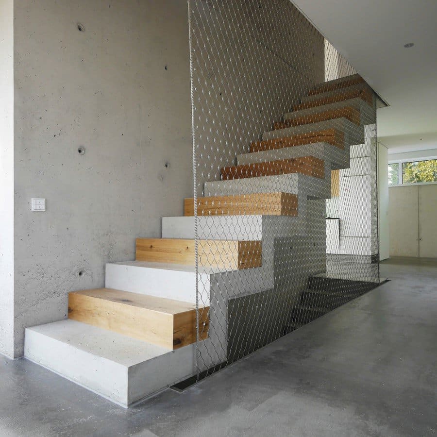 This German Family House is a Black Cuboid Supported by Glass Walls (8)