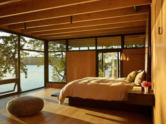 This Waterfront Retreat is Embraced by Dense Woods