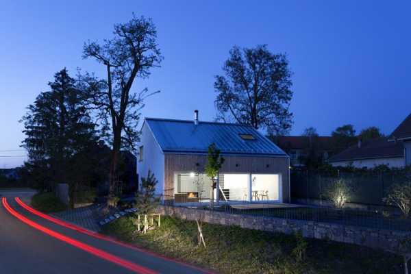 “Under the Calvary” House Has Traditional Shape and Modern Interiors