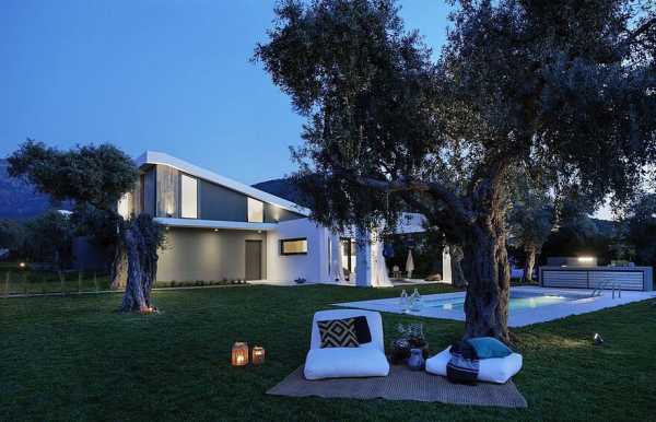 L-Shaped Villa Featuring Large Openings, Clean Surfaces and Bohemian Luxury 19