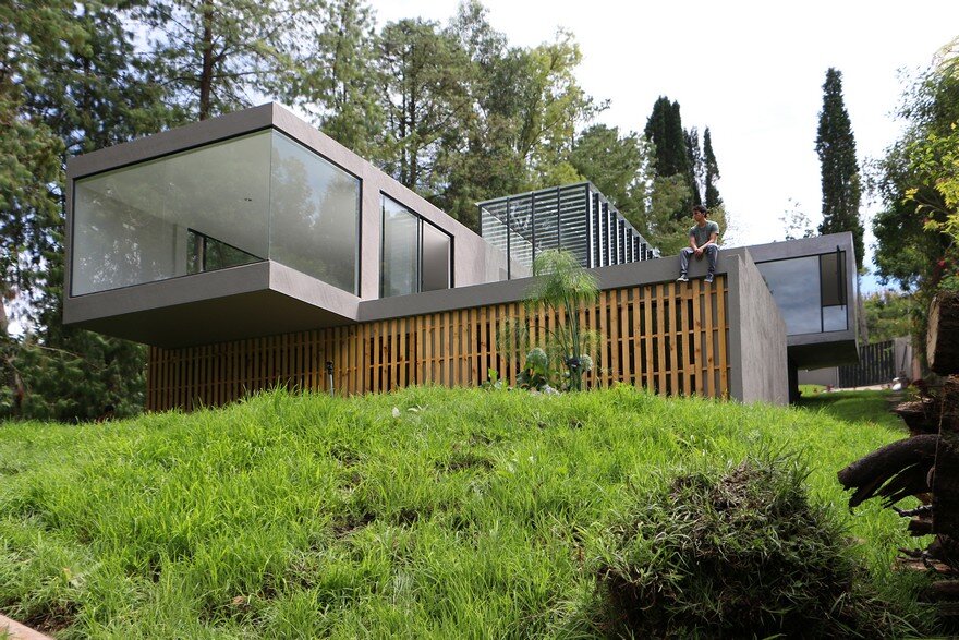 Contemporary Concrete House Suspended Like a Cloud Over Landscape