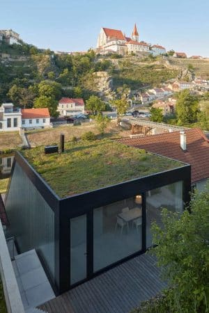 Family House on the Waterfront with a Green Roof / Kuba & Pilař Architekti