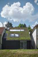 Family House on the Waterfront with a Green Roof / Kuba & Pilař Architekti