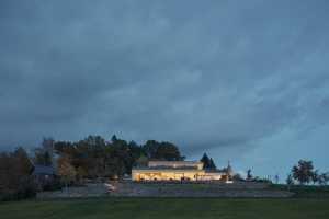 A Stone-Clad Villa Built into a Slope in Bohemian Paradise