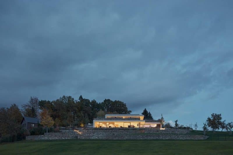 A Stone-Clad Villa Built into a Slope in Bohemian Paradise