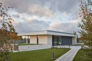 A Stone-Clad Villa Built into a Slope in Bohemian Paradise