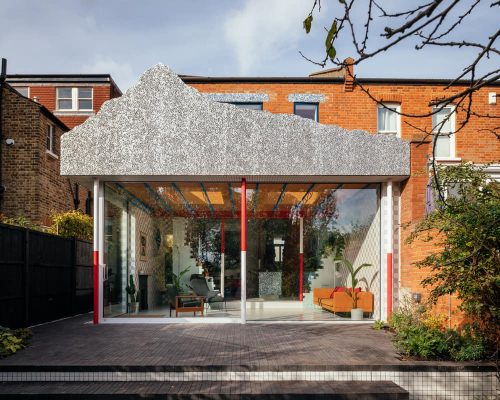 Colourful Family Home Topped with a Stage Set Mountain