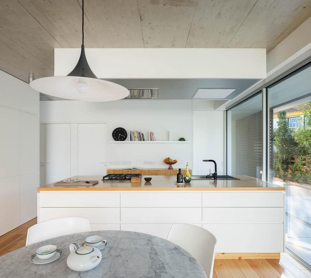 Concrete and Riga Wood Create Interior Confort in a Rural House