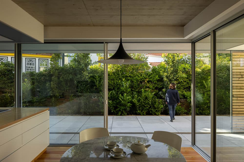 Concrete and Riga Wood Create Interior Confort in a Rural House