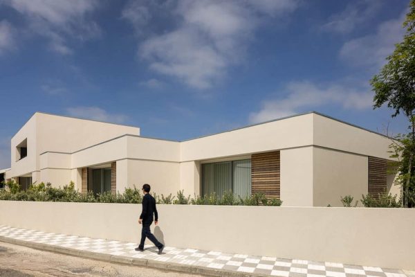 Concrete and Riga Wood Create Interior Confort in a Rural House