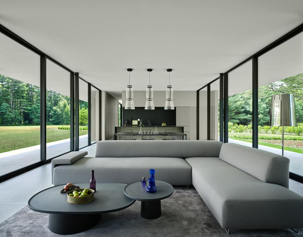 Minimalist Glass House Dots a 9 Acre Grass Field in Berkshires, MA