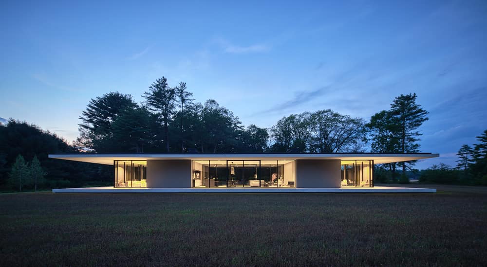 Minimalist Glass House Dots a 9 Acre Grass Field in Berkshires, MA